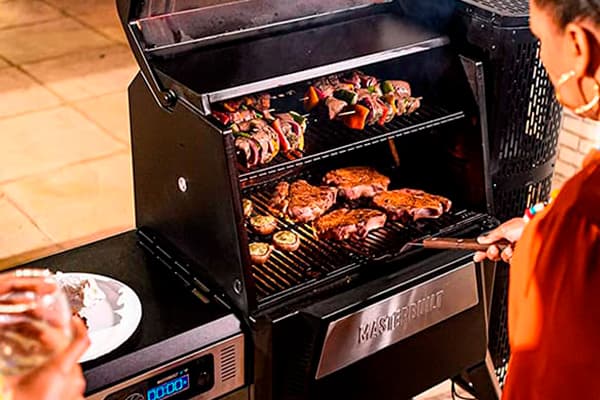 preparing food on a charcoal grill